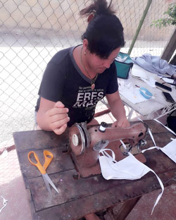 sewing a face mask in Cuba